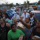 Hurricane Maria survivors receive food and water being given out by volunteers and municipal police as they deal with the aftermath of Hurricane Maria on Sept. 28, 2017, in Toa Baja, Puerto Rico. (Joe Raedle/Getty Images)